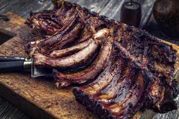Barbecue Pork Spare Ribs as top view on an old cutting board