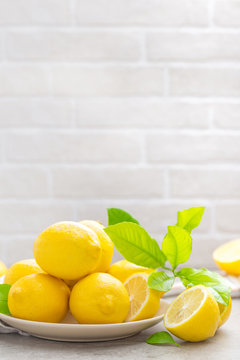 Fresh lemons with lemon leaves