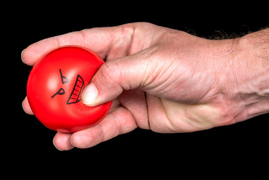 Angry Stress Ball Is Squeezed By A Hand