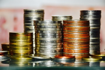 Stacks of coin,business finance and money concept.Abstract blurry background.
