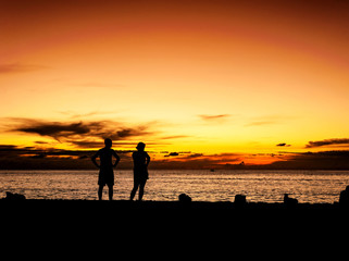 Silhouette lover on the beach sunset in twilight