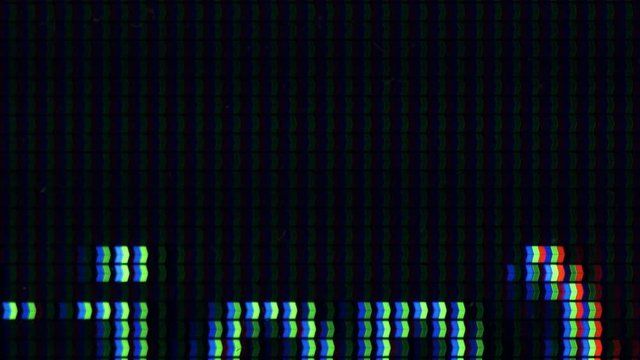 Extreme Closeup Of Monitor Pixels With Text Scrolling