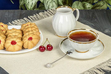 Tea fresh biscuits with cherries