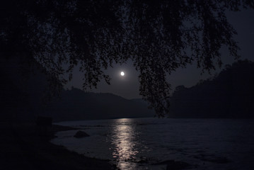 Moonrise over a river