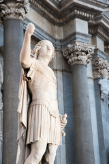 Night view of an external statue in the facade of Saint Agatha Church in Catania, Sicily