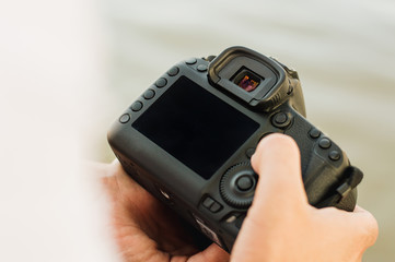 Photographer holding a digital camera