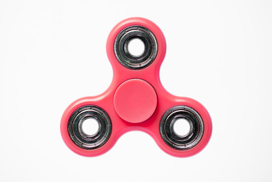 Red fidget Spinner isolated on white background