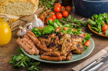 Grilled chicken wings and sausages