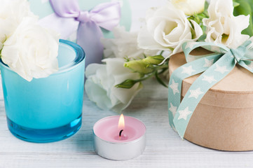 Arrangement of white eustoma flowers, gift boxes