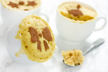 Microwave mug cake in white cups