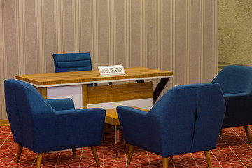 The sign with guest relation inscription is on the table. Guest accommodation in the hotel.  This service for the resolution of all complaints and problems among the hotel guests and tourists.