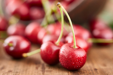 Close up of fresh cherry berries with water drops.