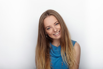 Headshot of young adorable blonde woman with cute smile on white background