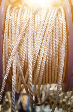 Thick steel braided cable at the Babyn closeup selective focus. Tinted glass. The vertical frame.