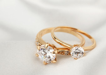 jewelry rings with diamond on white cloth, soft focus