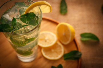 Mojito cocktail in a bur on a rustic table, selective focus