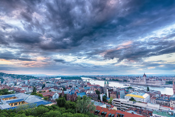 Parliament and riverside in Budapest Hungary with Dramatic sky during sunset