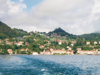 Fototapeta na wymiar Menaggio, Italy - august 25, 2015: Menaggio view with perspective and from the ferry landing stage