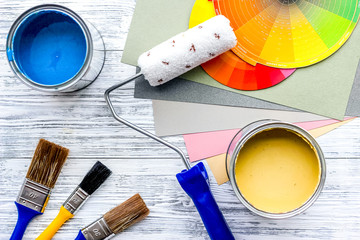 Set of tools for painting on grey wooden table background top view