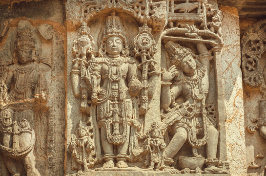 Vishnu Lord on wall of Indian temple. Example of ancient architecture, 12th century decoration inside the Hindu temple Hoysaleshwara in Halebidu, India.