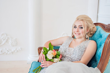 Obraz na płótnie Canvas Fashion bride in gray dress with make-up smoky eyes
