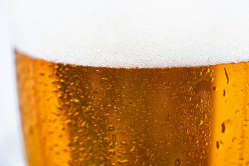 Close up of cold beer in a glass. Beer background