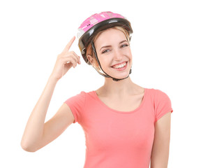 Beautiful young bicycle rider with helmet on white background