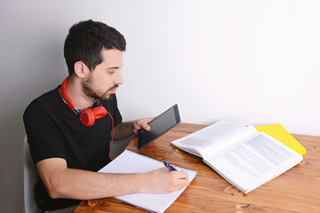 Man studying with tablet.