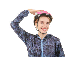 Beautiful young bicycle rider with helmet on white background