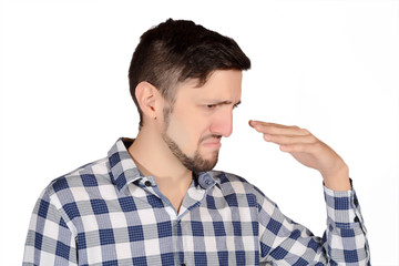 Man holding nose against bad smell.