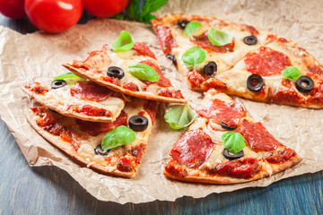 Slices of pizza pepperoni with olives