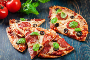 Slices of pizza pepperoni with olives