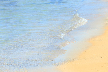 Warm sand and sea waves on beach