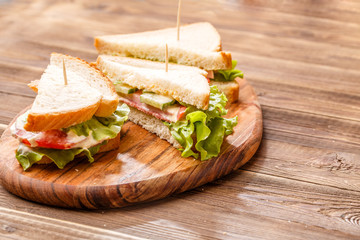 Burgers with toothpicks and vegetables