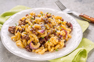 tasty cellentani pasta with meat sauce