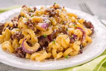 tasty cellentani pasta with meat sauce