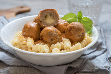 macaroni pasta with mozzarella stuffed meatballs