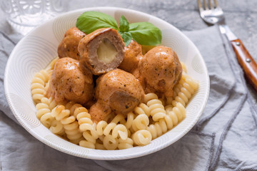 macaroni pasta with mozzarella stuffed meatballs
