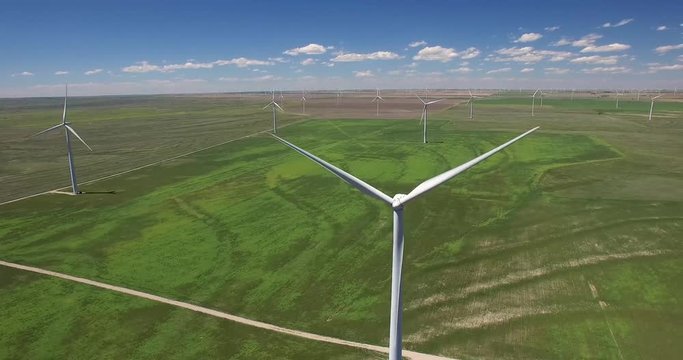 4K drone footage of turbines in wind farm (sideways views)