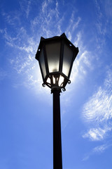 Fototapeta na wymiar Lamppost in backlight on sky