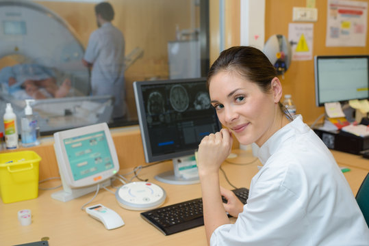 female doctor programming computer for medical scan