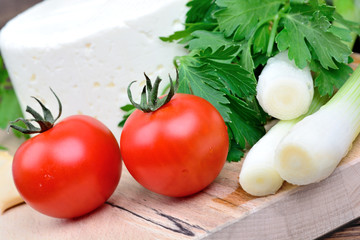 Vegetables with cheese on table