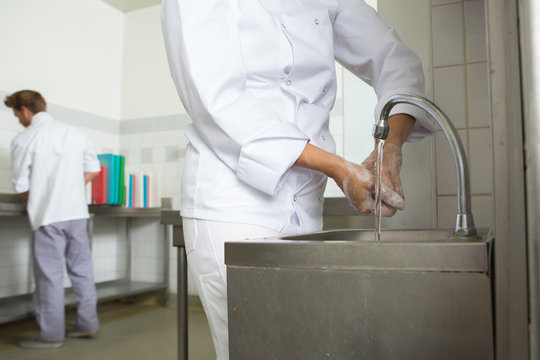 chef washing his hands prior to cook