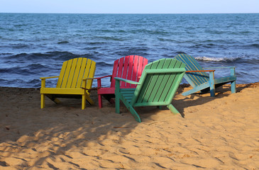 Beautiful colored chairs on the beach