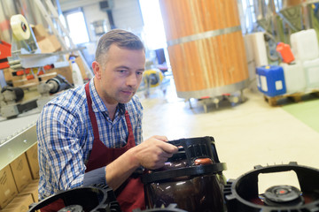 man filling canisters