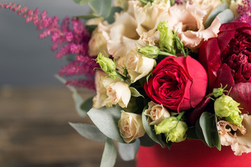 Bridal bouquet and boutonniere. Red and peach color flowers