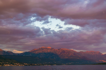Sunset in the sky of Montenegro over the high mountains.