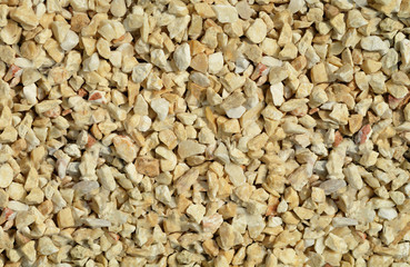 Yellow and white Pebbles, crushed stone decorate texture  background