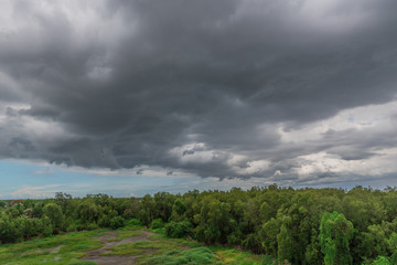 Rain clouds over the forest before a storm in rainy season.