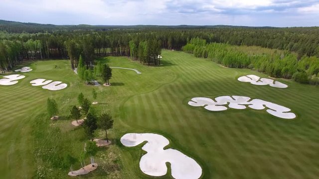 Top view green golf course outdoor green grass field. Aerial view from flying drone.